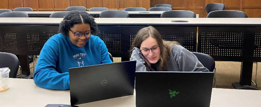 Students working on a group assignment together in a classroom